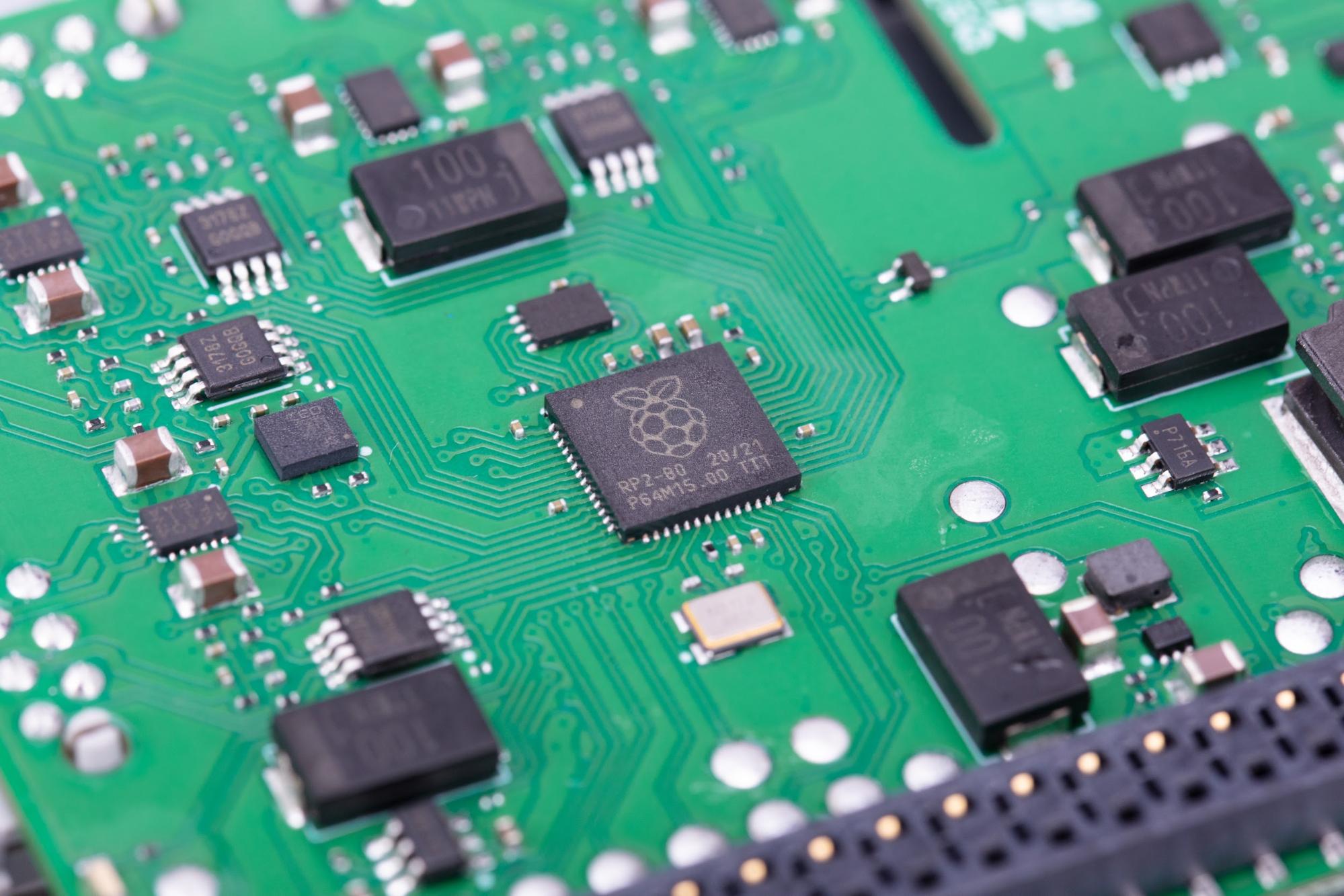 Close-up photo of part of the Raspberry Pi Build HAT, showing the Raspberry Pi RP2040 microchip